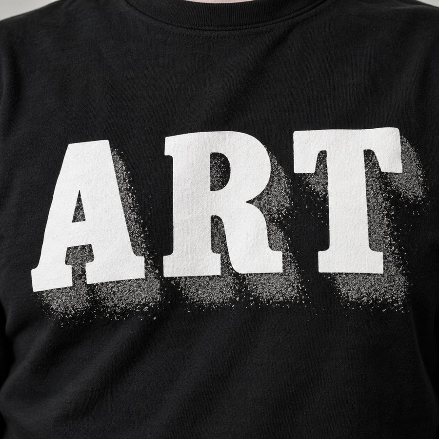 White letters with a grainy gray shadow smudge